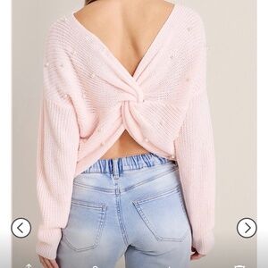 Francesca’s light pink beaded twist back sweater